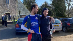 Thumbnail of http://Two%20men%20smiling%20after%20fundraising%20ultra%20marathon