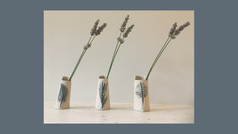 Photo of three vases with lavender in