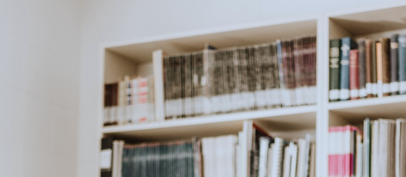 Banner of books and folders on shelf