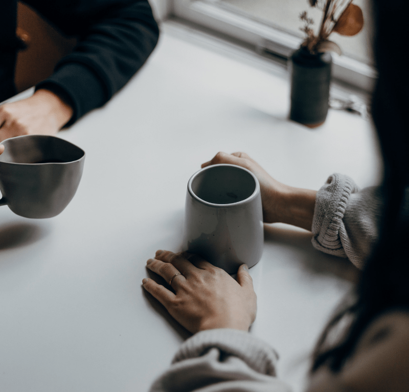 Two people drinking coffee