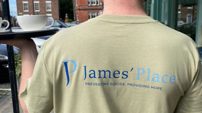 Man wearing James' Place tshirt