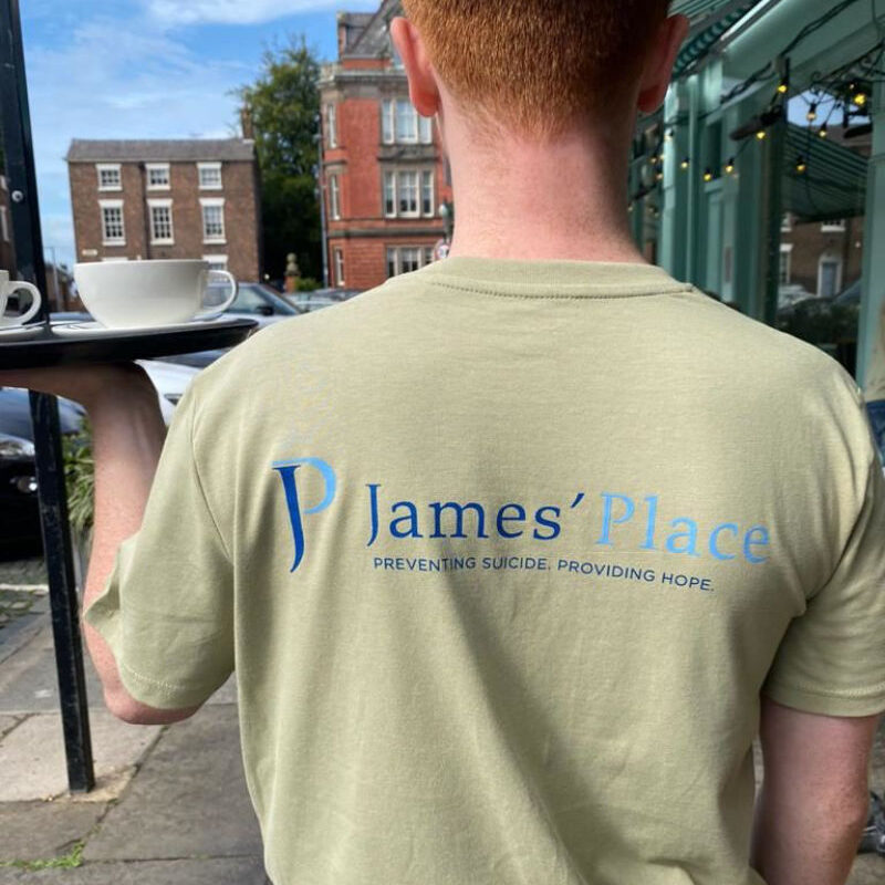 Man wearing James' Place tshirt