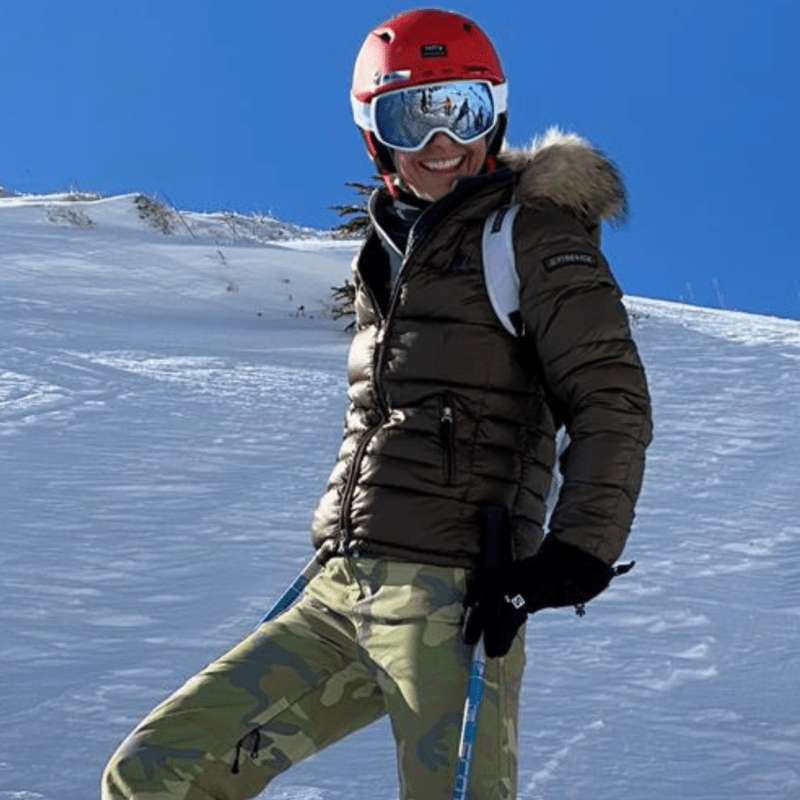 Woman on skis on snowy mountain
