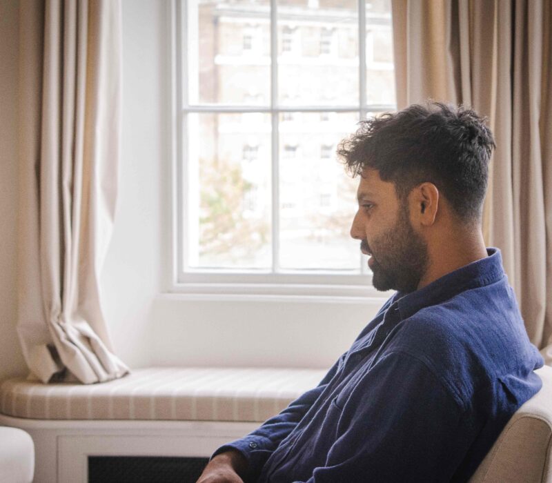 Man sitting in James' Place therapy room