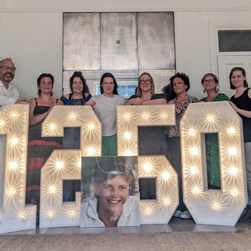 James Place Liverpool team standing in front of 1250 lit up numbers.