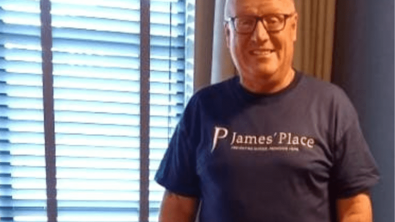 Image of man in a James' Place tshirt