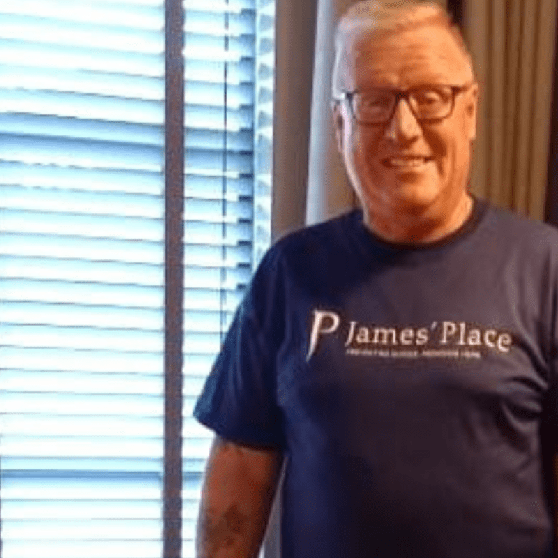 Image of man in a James' Place tshirt