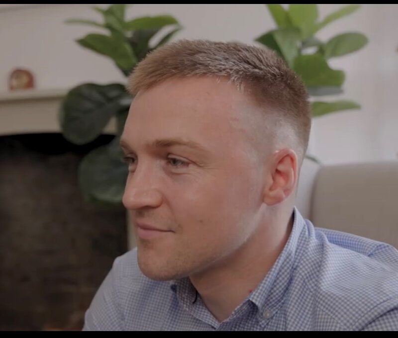 Side profile image of man smiling