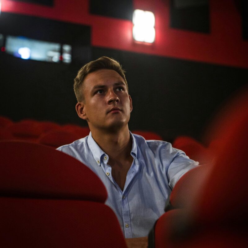 Man sat in a theatre