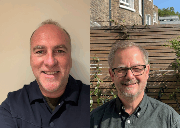 Two men smiling at camera