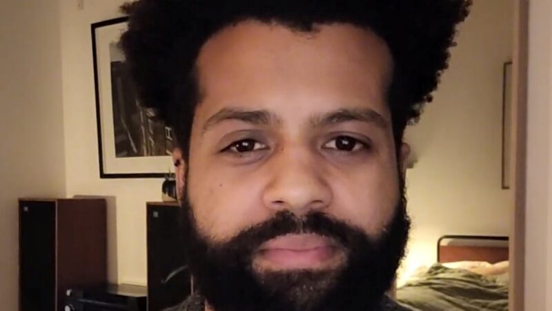 Man with beard looking at camera