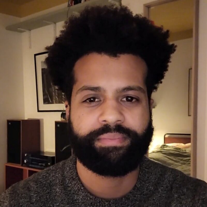 Man with beard looking at camera